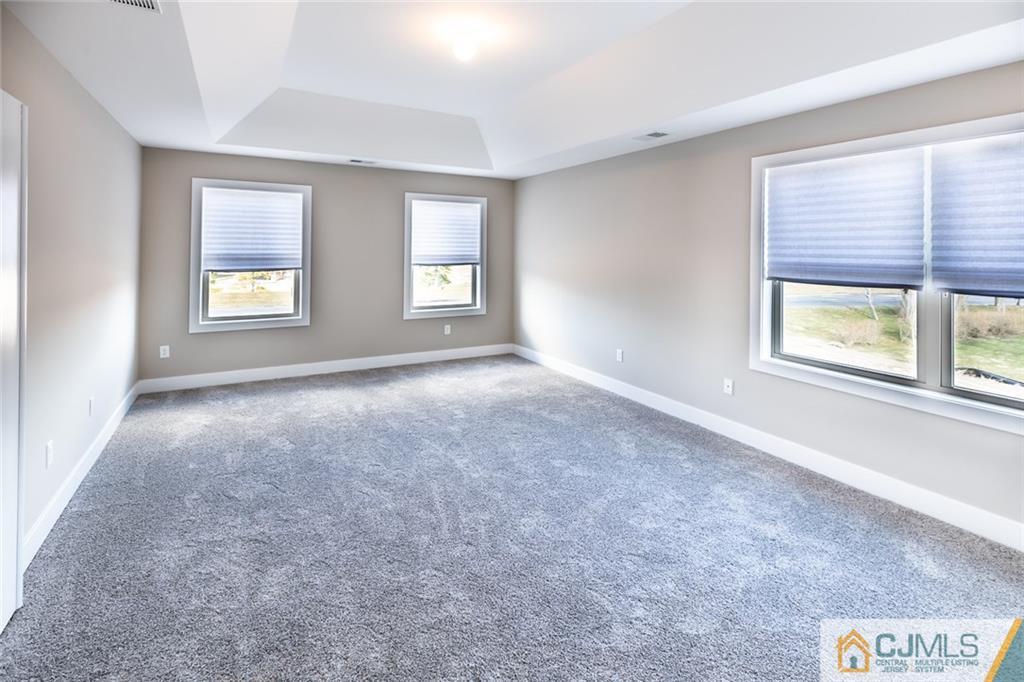 123 Millhurst Road Manalapan, NJ 07726 - Photo 13 of 27 an empty room with windows