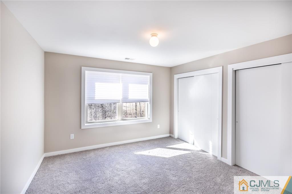123 Millhurst Road Manalapan, NJ 07726 - Photo 16 of 27 a view of an empty room with a window
