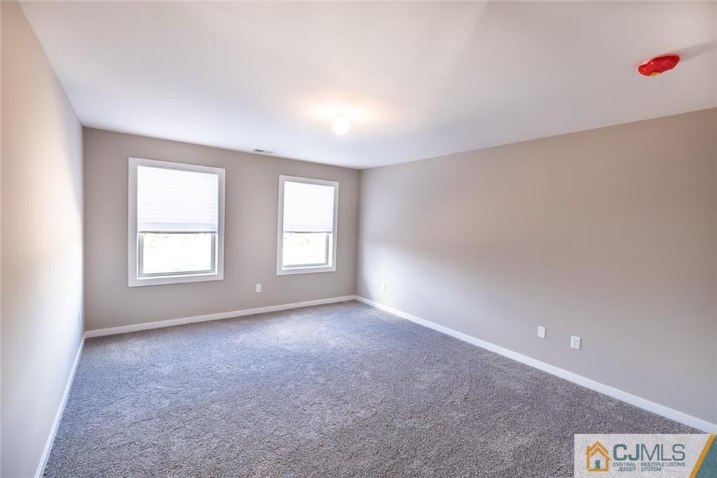 123 Millhurst Road Manalapan, NJ 07726 - Photo 17 of 27 a view of an empty room with a window