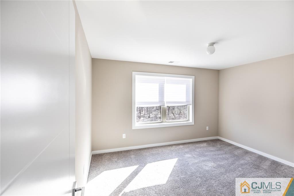 123 Millhurst Road Manalapan, NJ 07726 - Photo 20 of 27 an empty room with a window