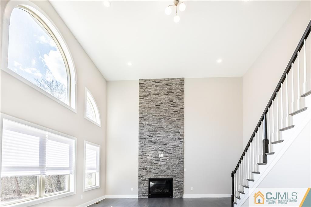123 Millhurst Road Manalapan, NJ 07726 - Photo 9 of 27 a view of entryway with wooden floor