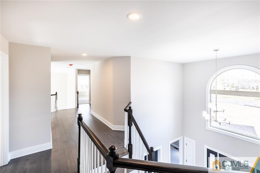 123 Millhurst Road Manalapan, NJ 07726 - Photo 10 of 27 a view of an entryway with wooden floor