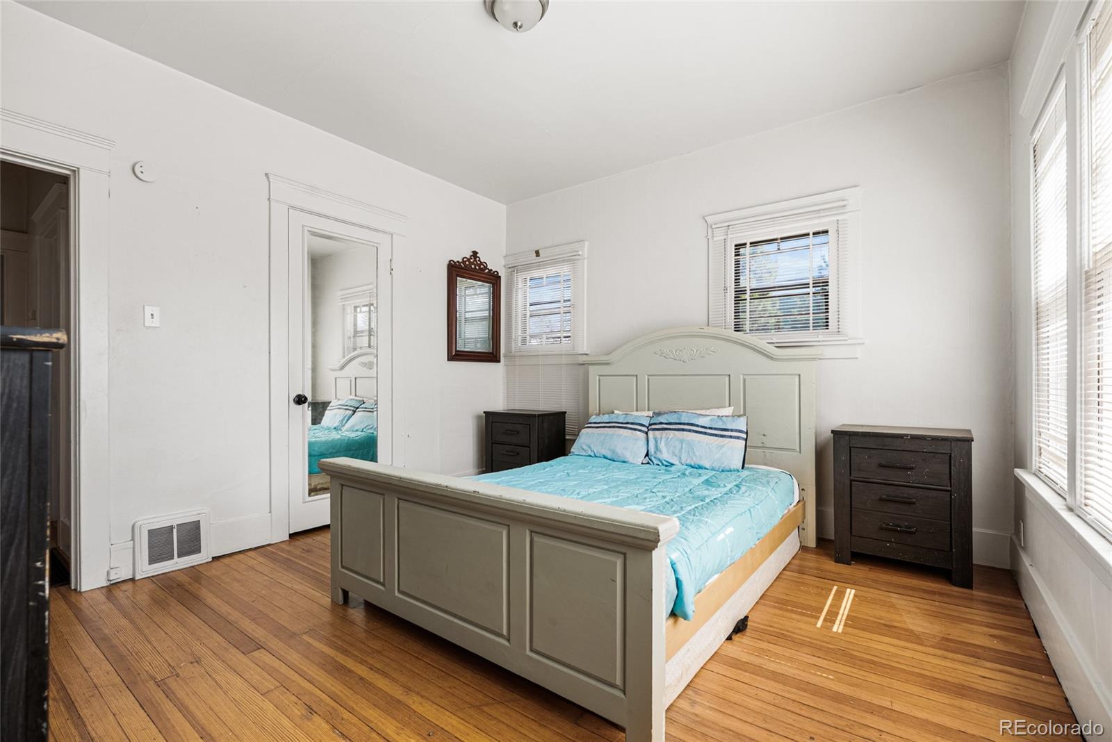 1117 16th Street Greeley, CO 80631 - Photo 13 of 37 a bedroom with a bed and a table