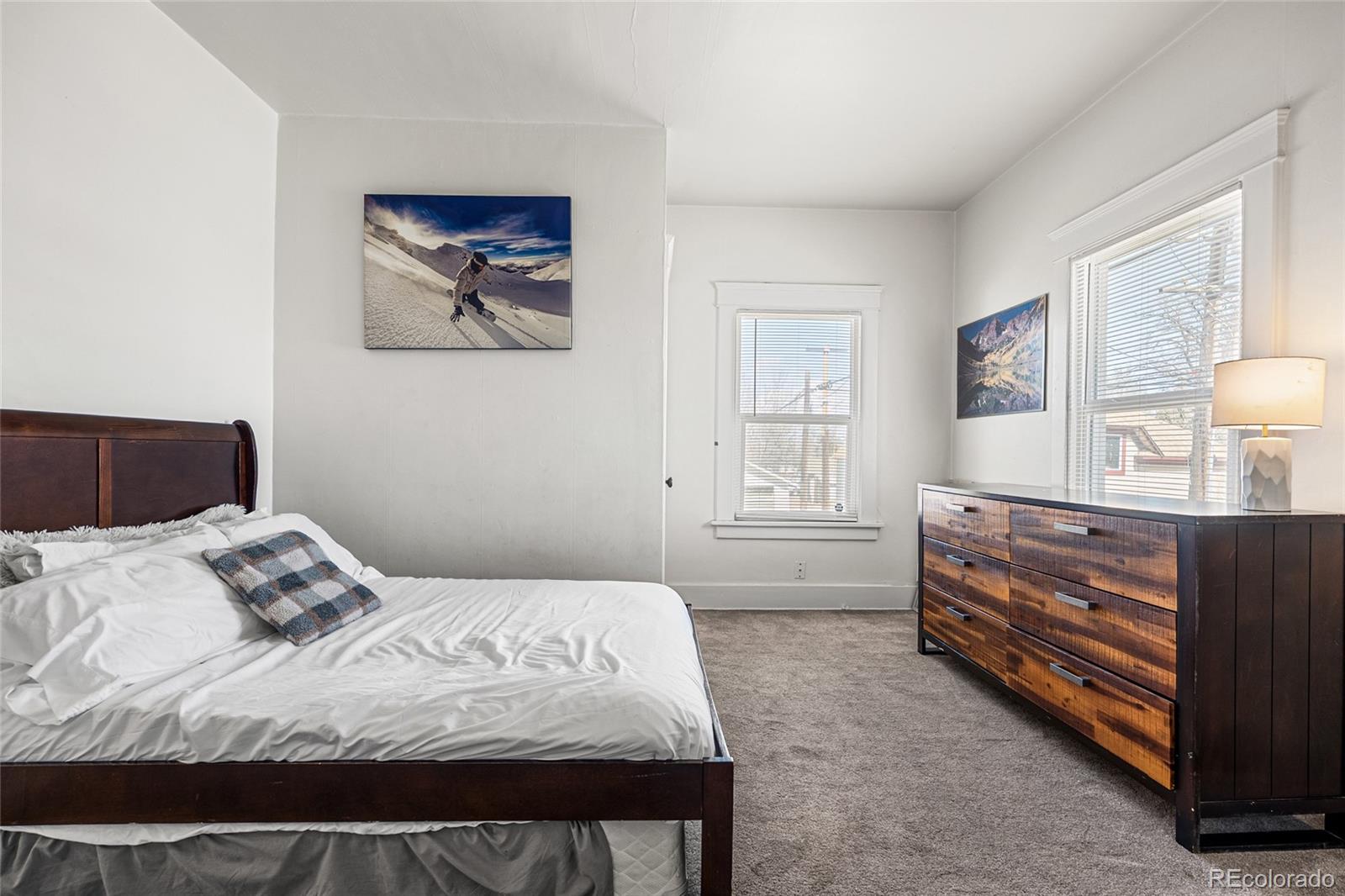 1117 16th Street Greeley, CO 80631 - Photo 20 of 37 a bedroom with a bed and a dresser