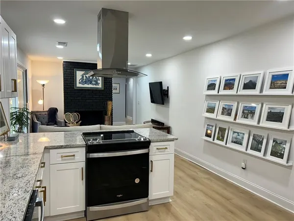 a kitchen with a stove and a sink