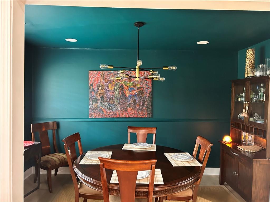3271 Kelley Chapel Road Decatur, GA 30034 - Photo 16 of 27 a view of a dining room with furniture and wooden floor