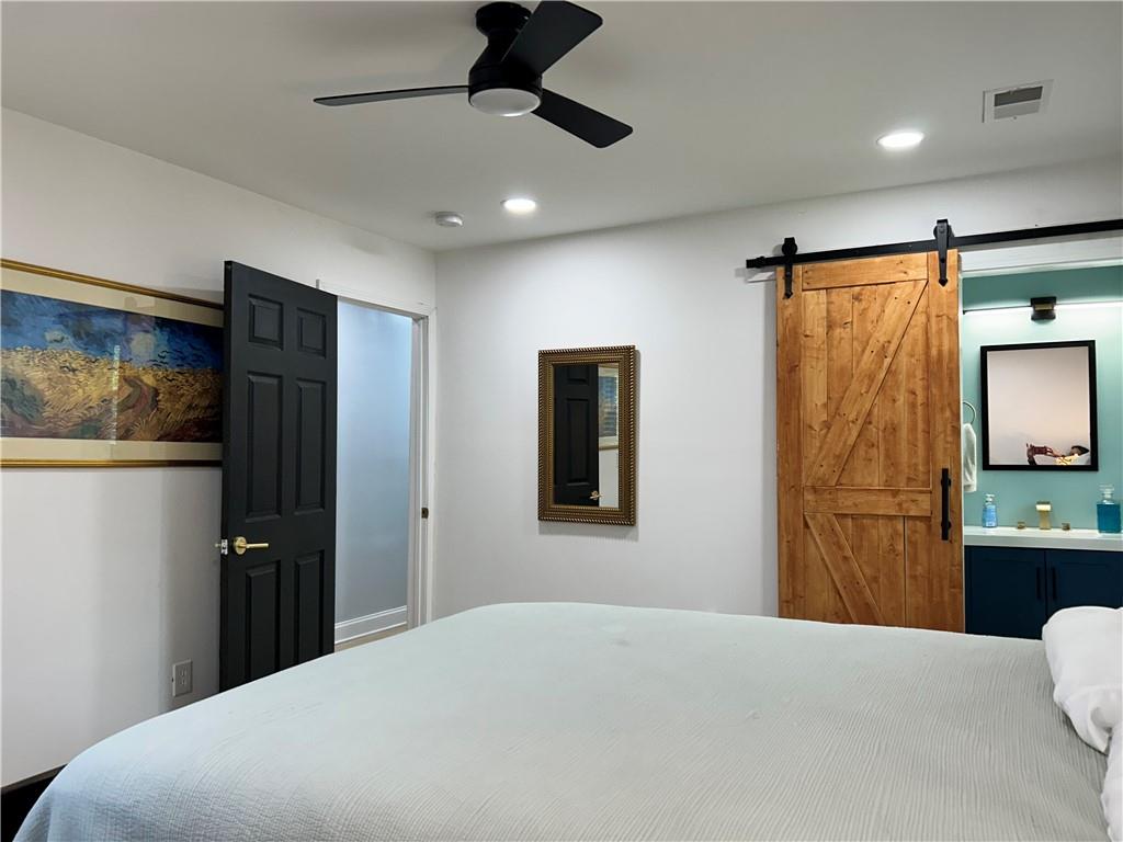 3271 Kelley Chapel Road Decatur, GA 30034 - Photo 18 of 27 a bedroom with a bed and a television