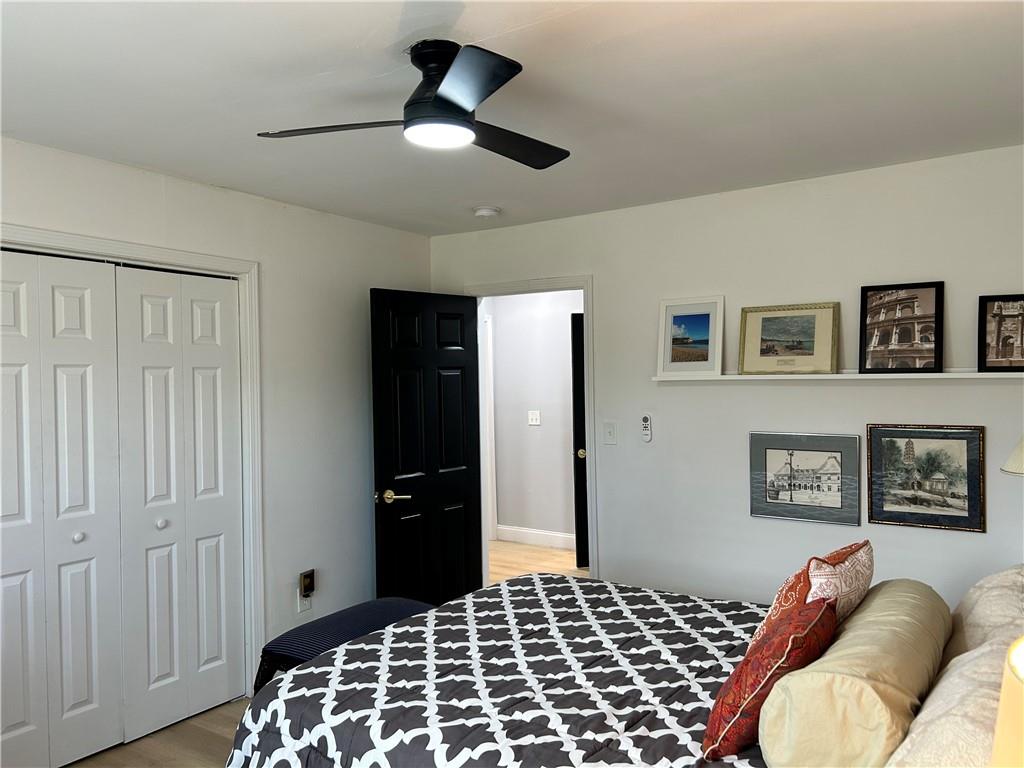 3271 Kelley Chapel Road Decatur, GA 30034 - Photo 19 of 27 a bedroom with a bed and a chandelier