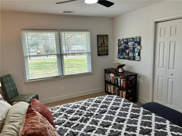 a bedroom with a bed and a desk
