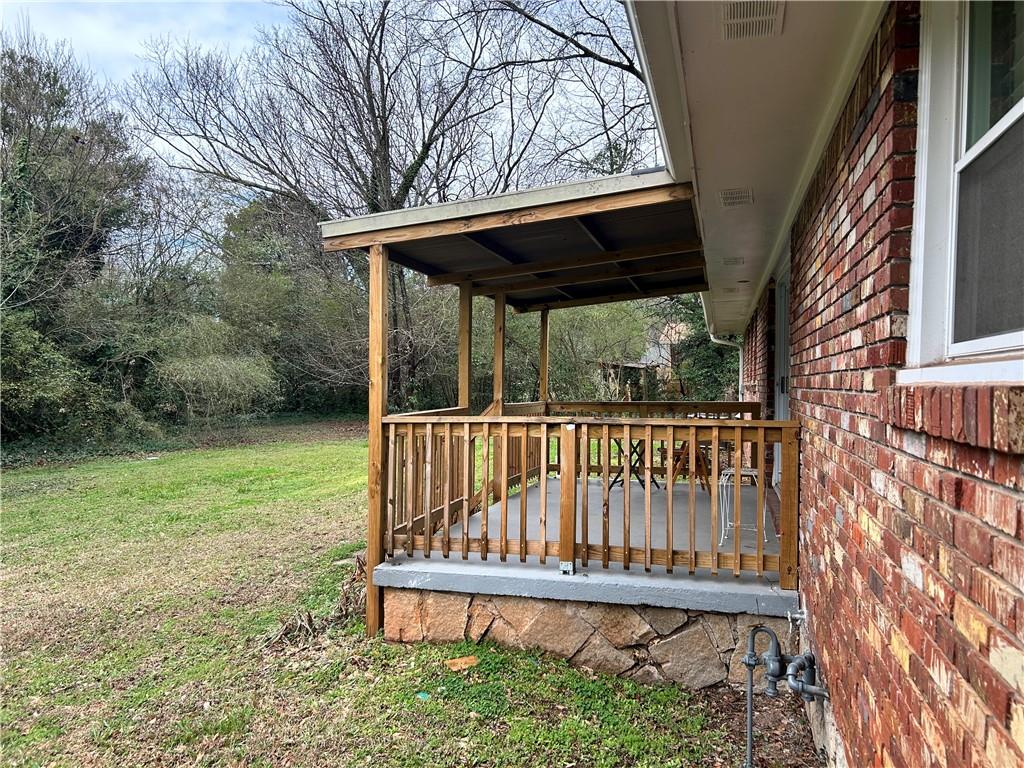 3271 Kelley Chapel Road Decatur, GA 30034 - Photo 25 of 27 a view of a porch with a table and chairs