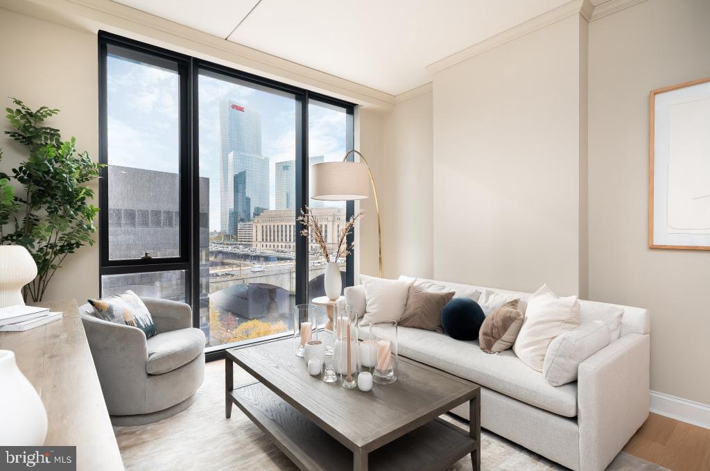 2301-61 John F Kennedy Boulevard, Unit 1815 Philadelphia, PA 19103 - Photo 23 of 39 a living room with furniture and a large window