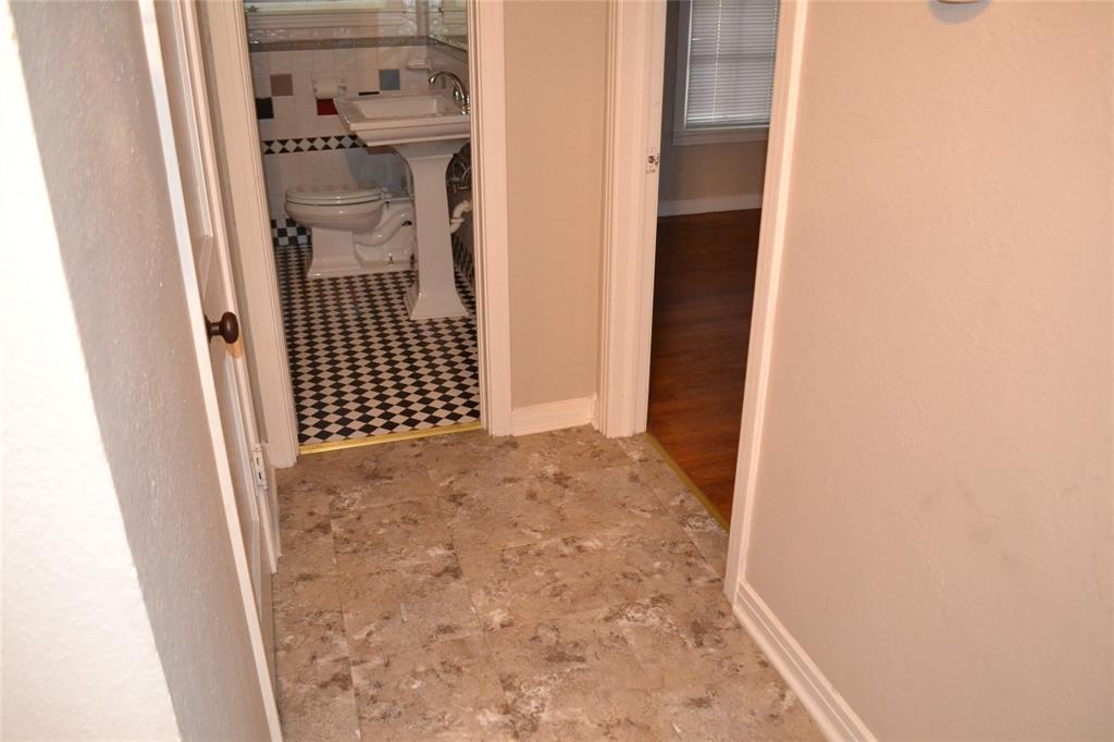 919 Denton Street Denton, TX 76201 - Photo 15 of 23 Clean bathroom entry featuring modern tile flooring.