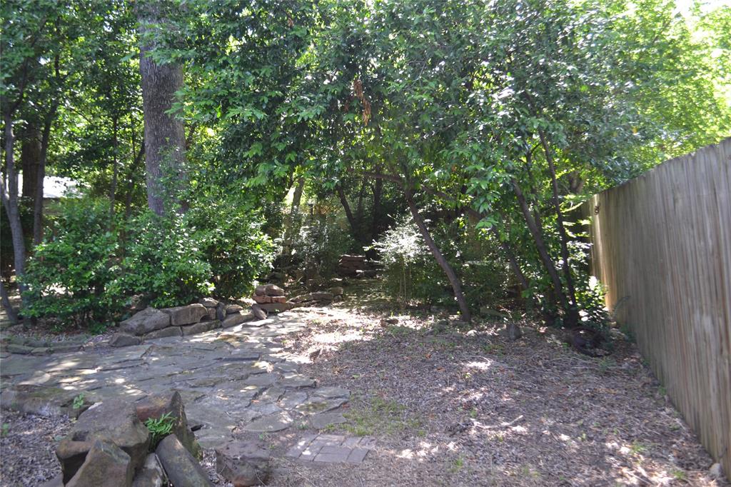 919 Denton Street Denton, TX 76201 - Photo 19 of 23 Lush, wooded backyard providing excellent shade and privacy.