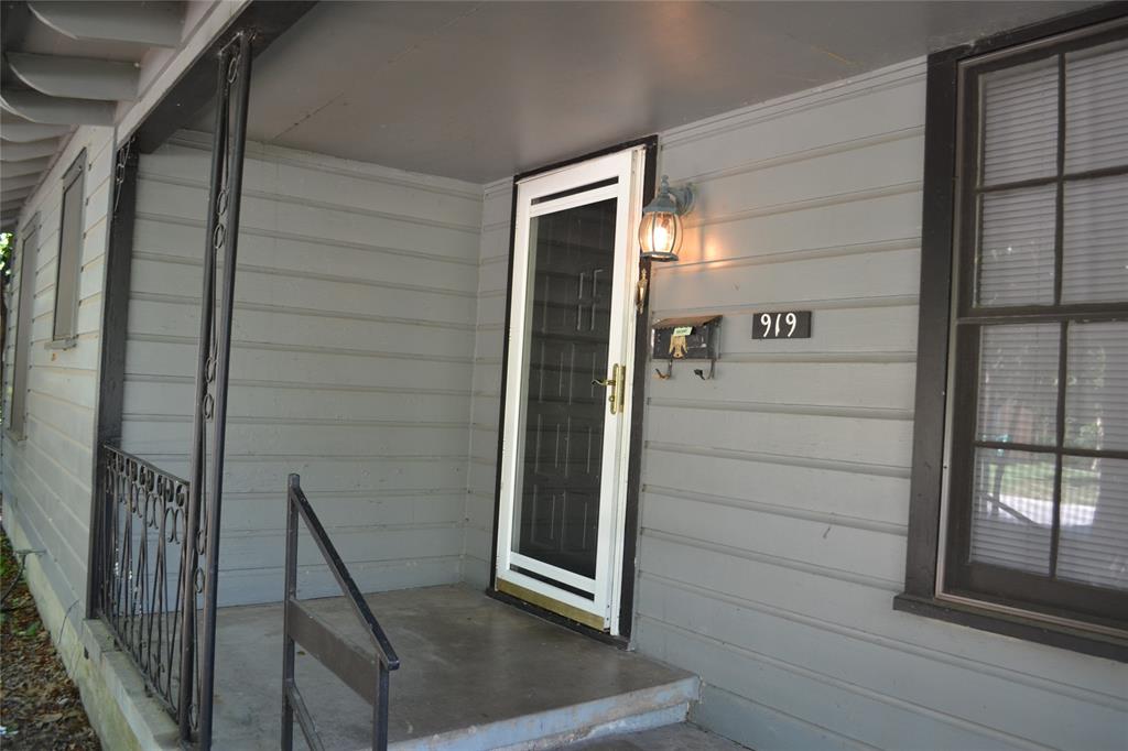 919 Denton Street Denton, TX 76201 - Photo 2 of 23 Covered front porch area with a clean, neutral exterior.