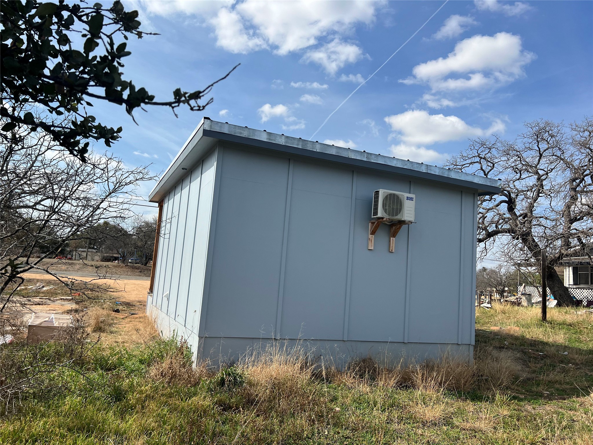 0 Ranch Road 2545 Kingsland, TX 78639 - Photo 9 of 22 a front view of a house with garden
