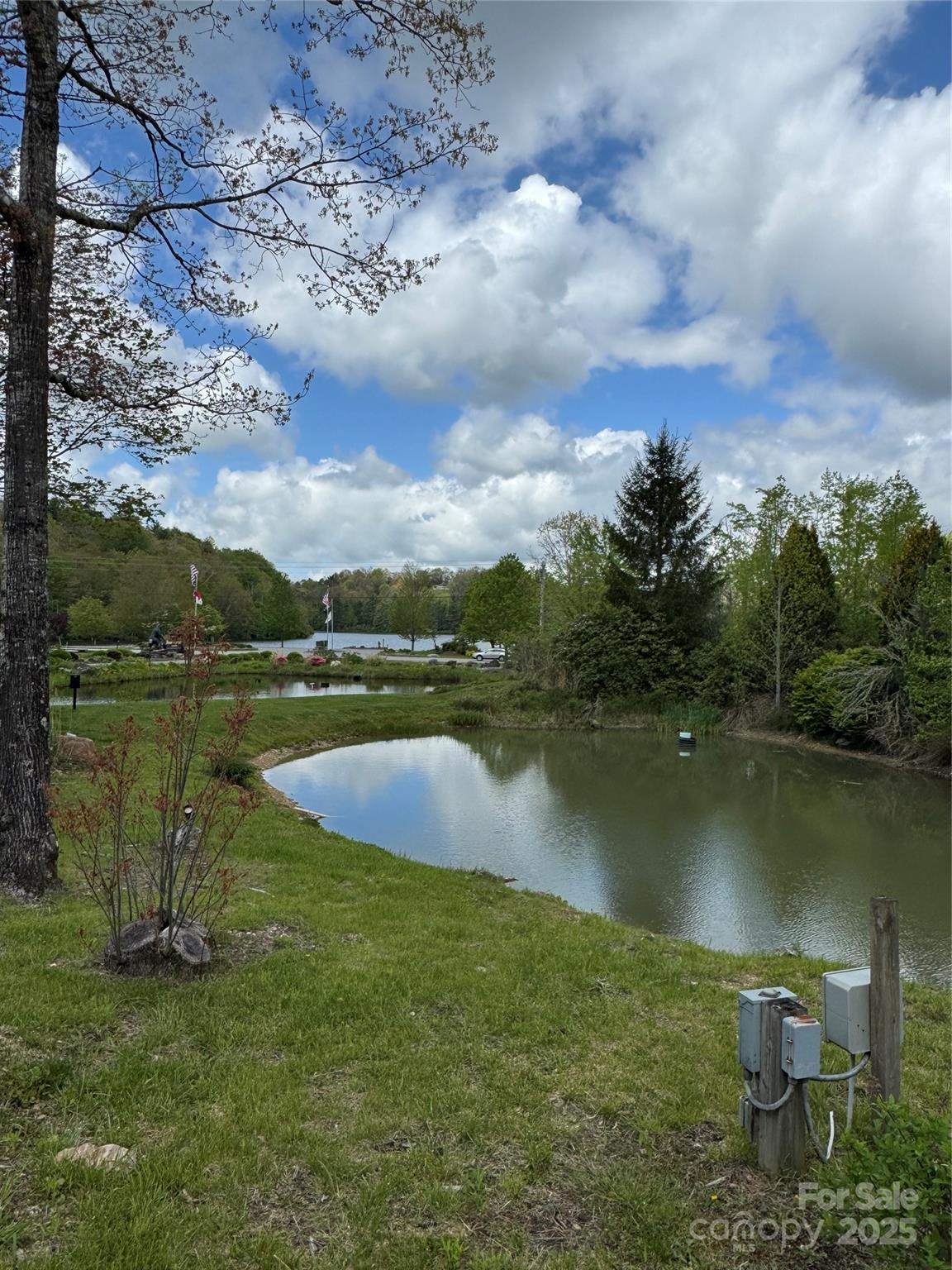 Tbd Black Bear Trail, Unit 23 Newland, NC 28657 - Photo 12 of 13 a view of a lake with a house in the background