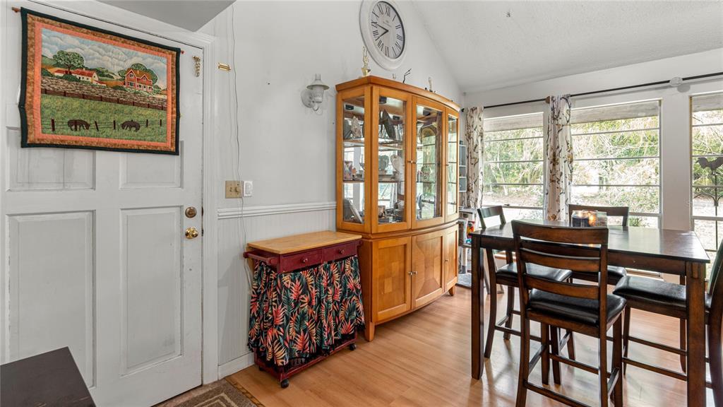 19036 Northwest 246th Street High Springs, FL 32643 - Photo 12 of 30 a view of a dining room with furniture window and outside view