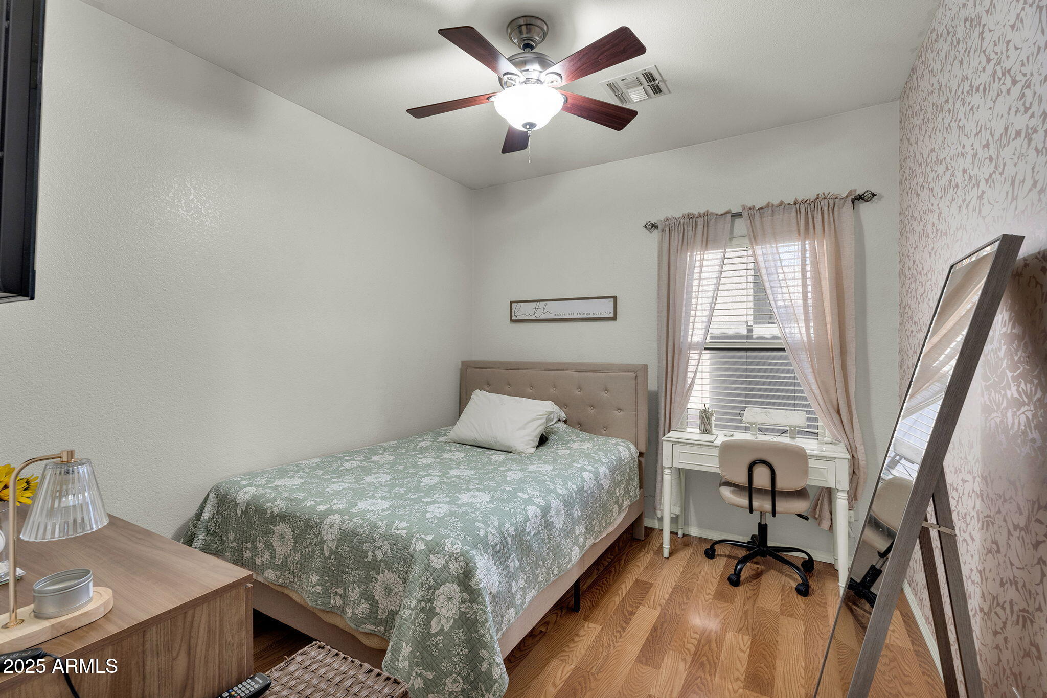 13122 West Calavar Road Surprise, AZ 85379 - Photo 20 of 34 a bedroom with a bed and a table
