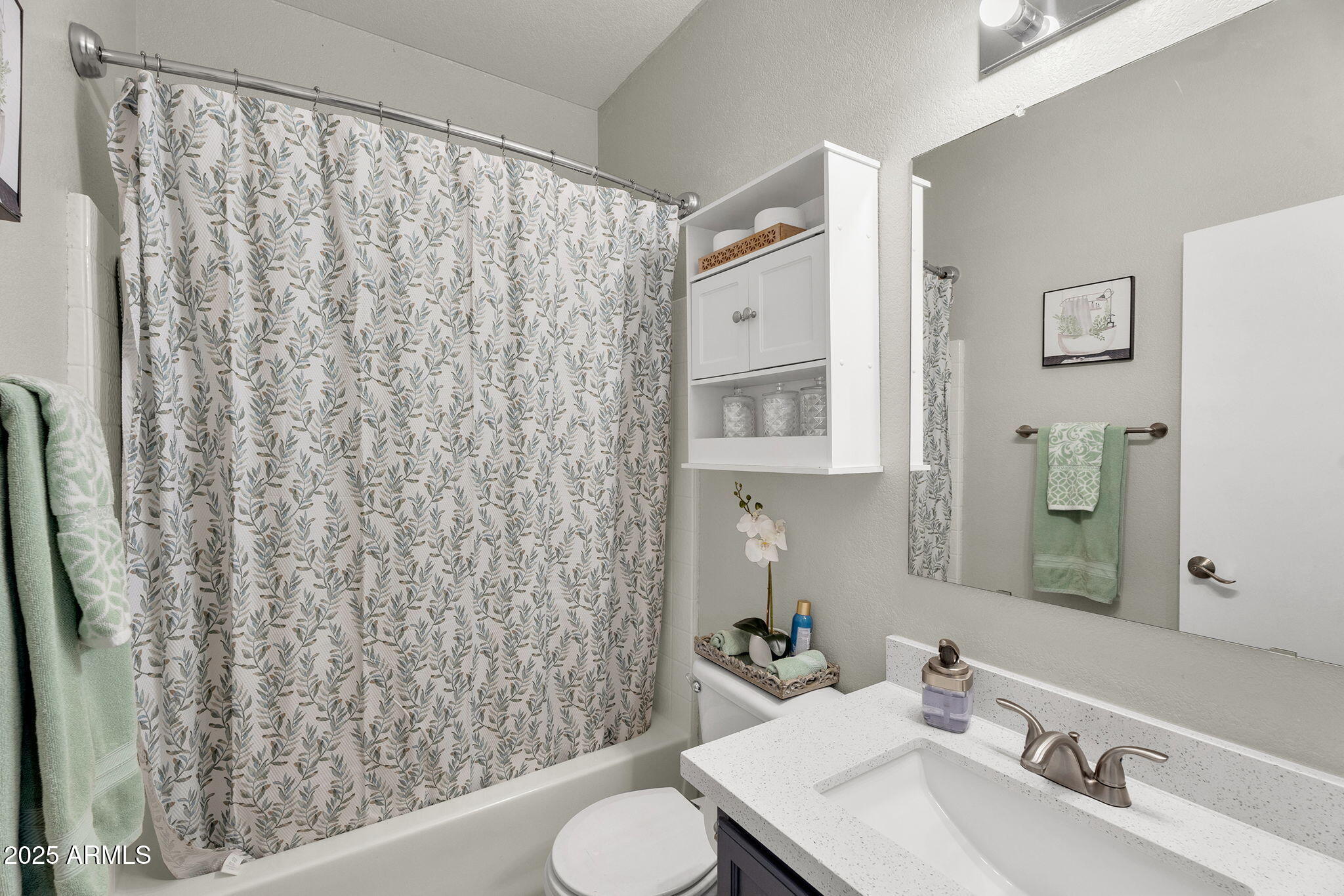 13122 West Calavar Road Surprise, AZ 85379 - Photo 25 of 34 a bathroom with a sink toilet and shower