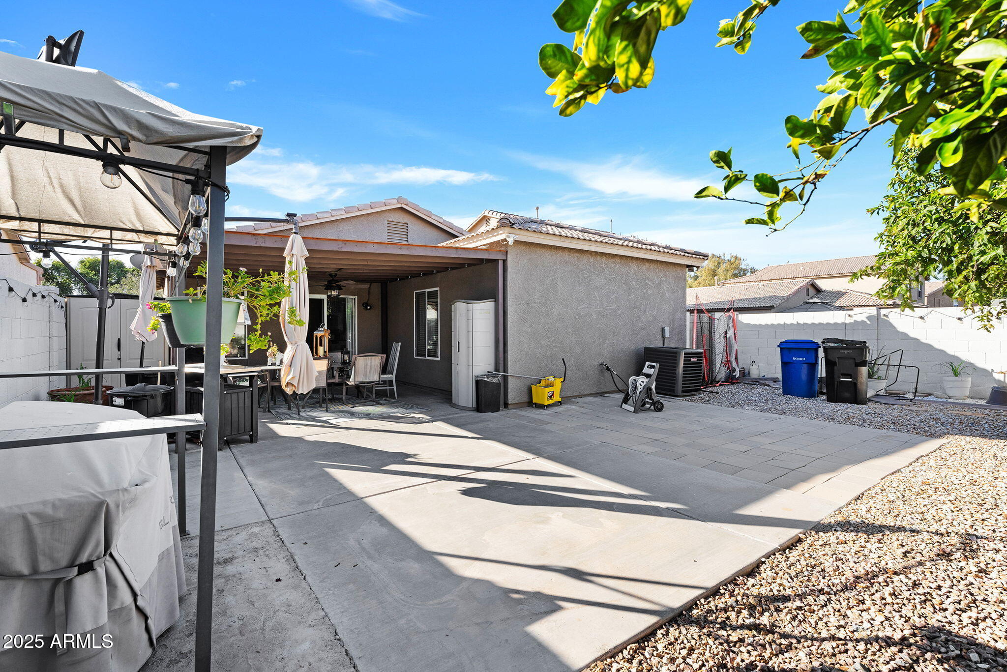 13122 West Calavar Road Surprise, AZ 85379 - Photo 27 of 34 a view of a chairs and table in the patio