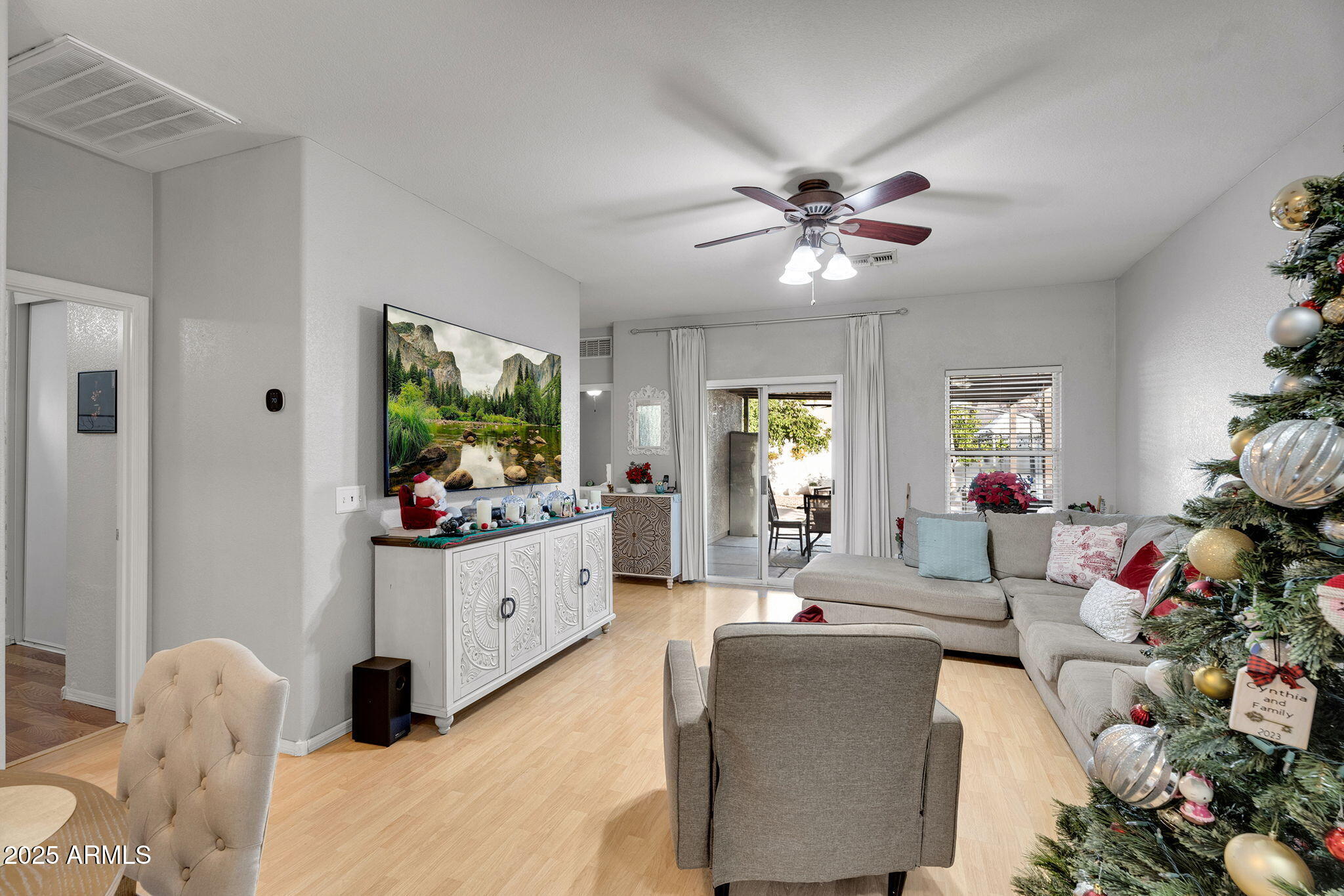 13122 West Calavar Road Surprise, AZ 85379 - Photo 6 of 34 a living room with furniture and a flat screen tv