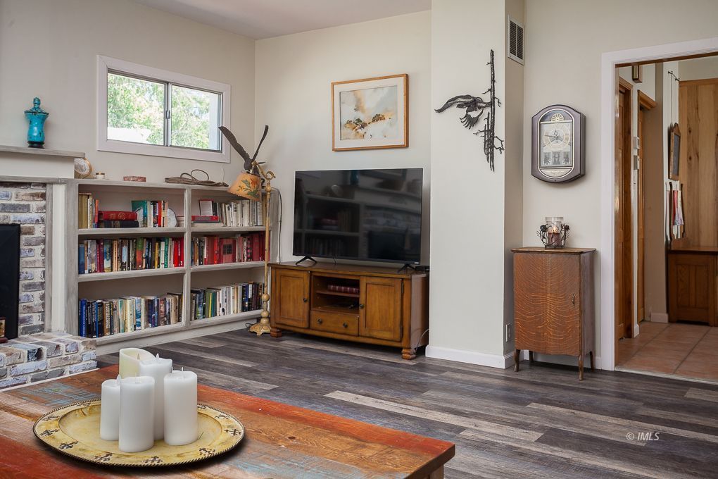 110 North Hay Street Lone Pine, CA 93545 - Photo 11 of 23 a living room with furniture and a fireplace