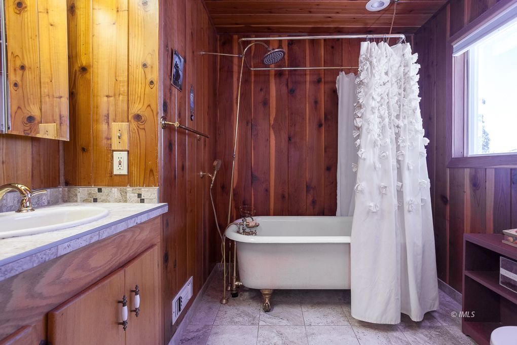 110 North Hay Street Lone Pine, CA 93545 - Photo 16 of 23 a bathroom with a tub sink and shower