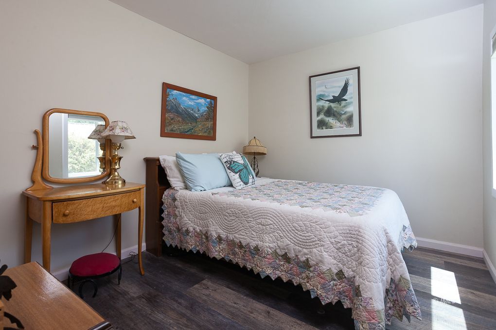 110 North Hay Street Lone Pine, CA 93545 - Photo 17 of 23 a bedroom with bed and paintings on the wall