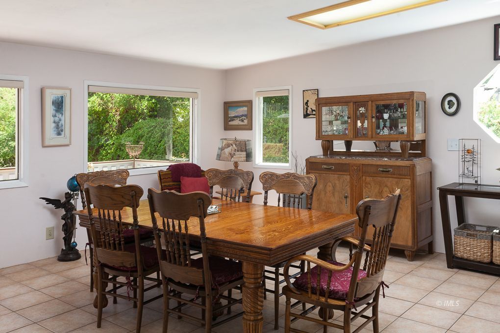 110 North Hay Street Lone Pine, CA 93545 - Photo 9 of 23 a view of a dining room with furniture and a window