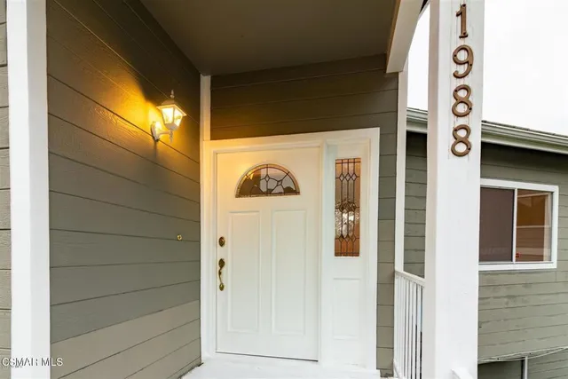 a large kitchen with stainless steel appliances granite countertop a stove a sink dishwasher and a refrigerator