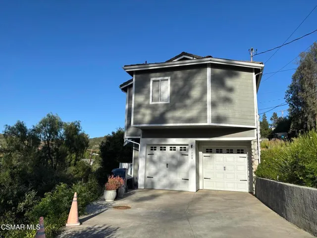 a view of a town with mountains in the background