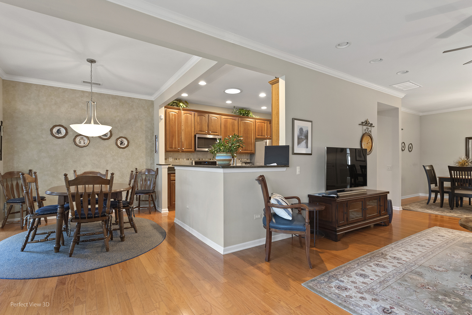 2468 Rolling Ridge Elgin, IL 60124 - Photo 13 of 29 a living room with furniture kitchen view and a wooden floor