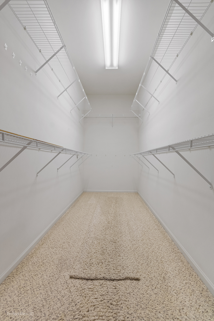 2468 Rolling Ridge Elgin, IL 60124 - Photo 17 of 29 an empty room with white walls washer and dryer