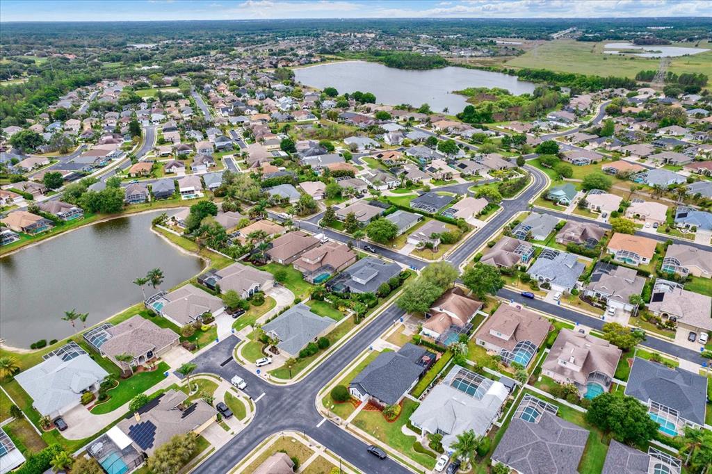2021 Meadow Rue Court Trinity, FL 34655 - Photo 32 of 41 an aerial view of a city with lake view