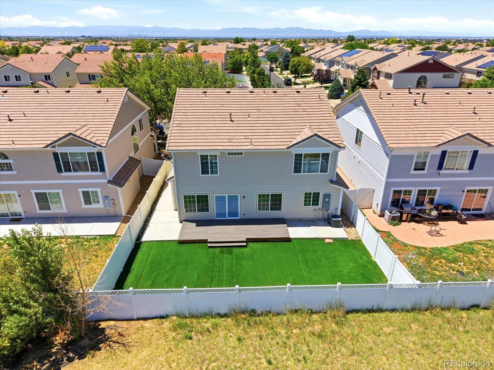 5444 Perth Court Denver, CO 80249 - Photo 43 of 46 an aerial view of a house with swimming pool garden and patio