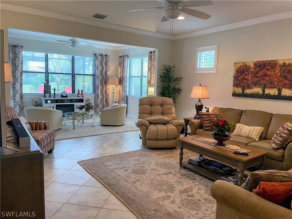 10934 Dennington Road Fort Myers, FL 33913 - Photo 15 of 15 a living room with furniture and a large window