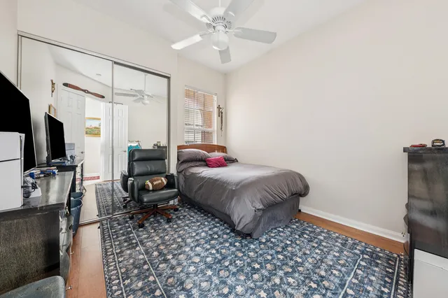 a kitchen with white cabinets and sink