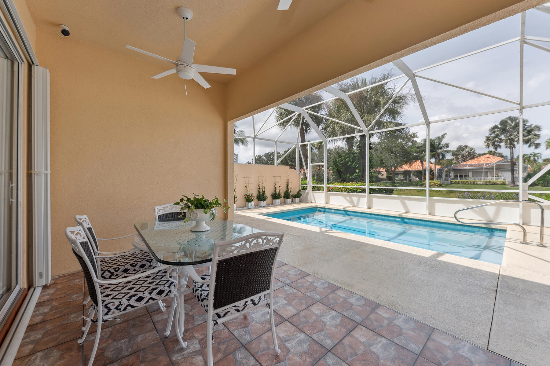 2613 James River Road West Palm Beach, FL 33411 - Photo 19 of 57 a view of a chairs and table in the patio