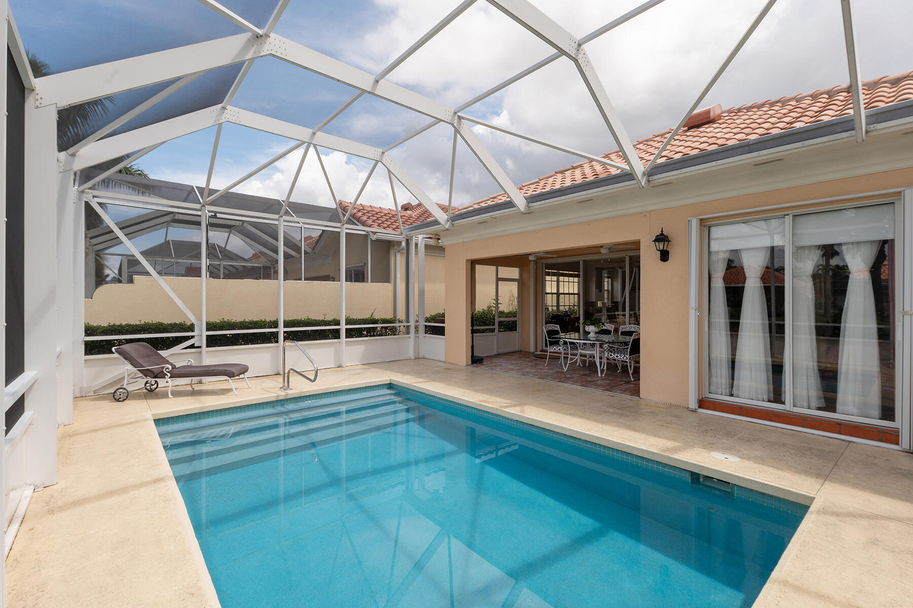 2613 James River Road West Palm Beach, FL 33411 - Photo 22 of 57 a swimming pool with glass windows and painted walls