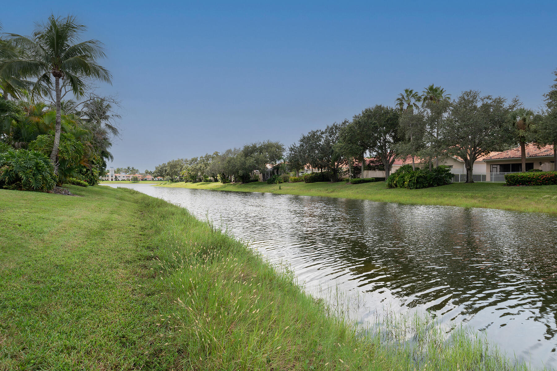 2613 James River Road West Palm Beach, FL 33411 - Photo 23 of 57 a view of a lake with houses in the background