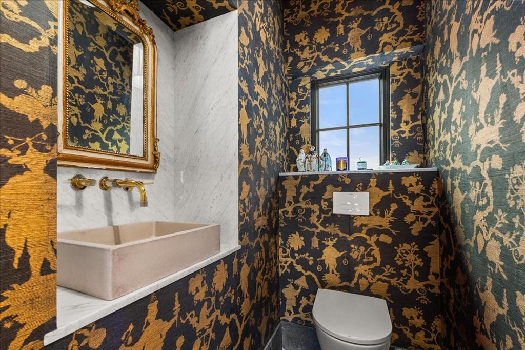 4259 Crestline Road Fort Worth, TX 76107 - Photo 12 of 40 a bathroom with a sink a toilet and shower curtain