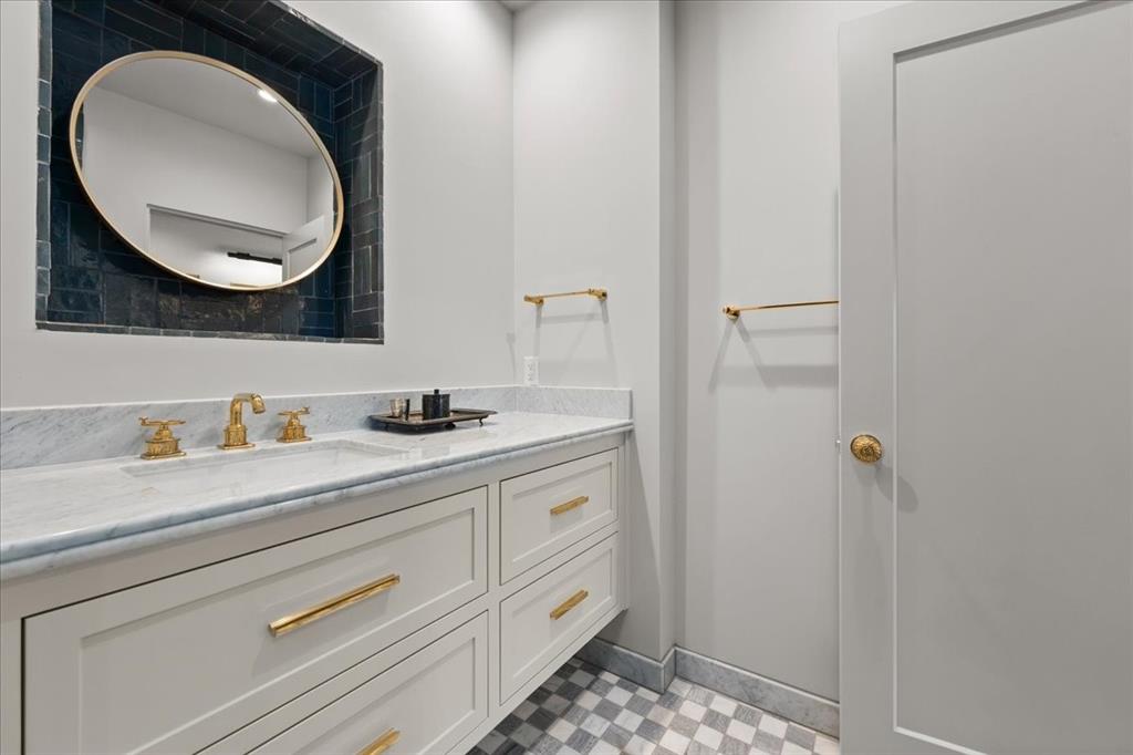 4259 Crestline Road Fort Worth, TX 76107 - Photo 16 of 40 a bathroom with a sink and a mirror