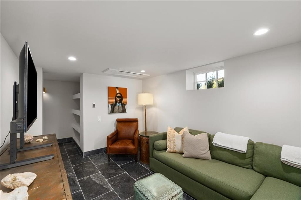 4259 Crestline Road Fort Worth, TX 76107 - Photo 23 of 40 a living room with furniture and a flat screen tv