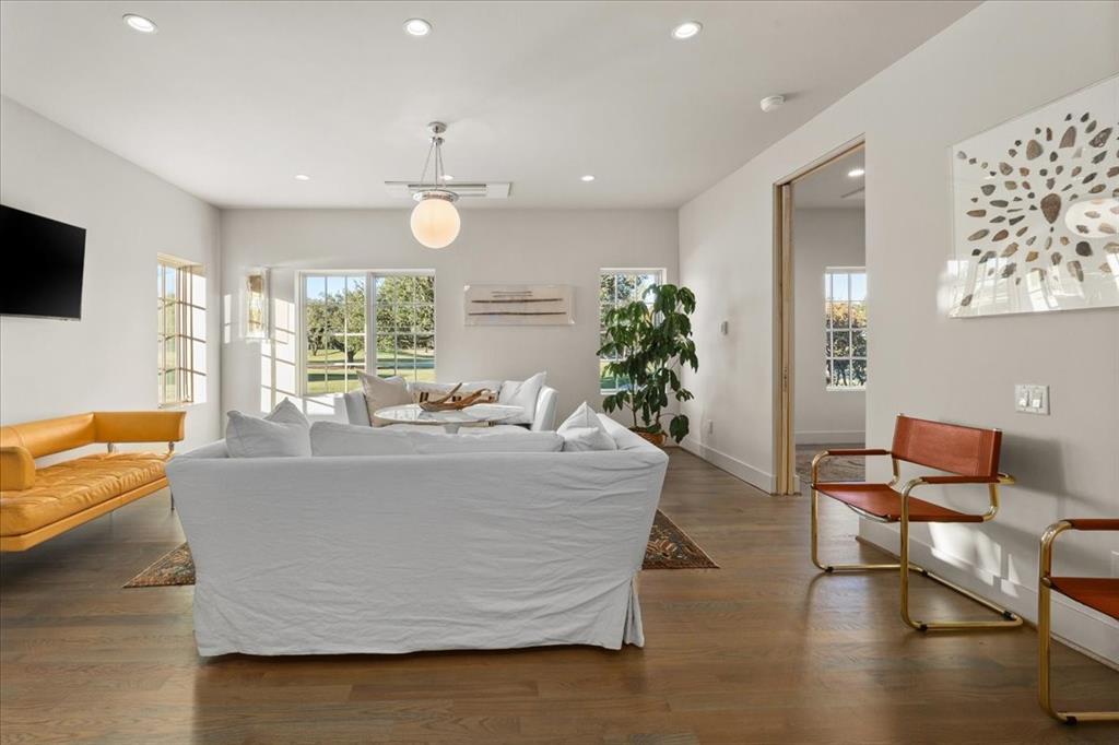 4259 Crestline Road Fort Worth, TX 76107 - Photo 32 of 40 a living room with furniture and a chandelier