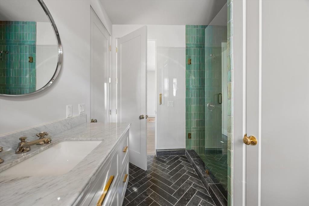 4259 Crestline Road Fort Worth, TX 76107 - Photo 36 of 40 a bathroom with a sink and a mirror