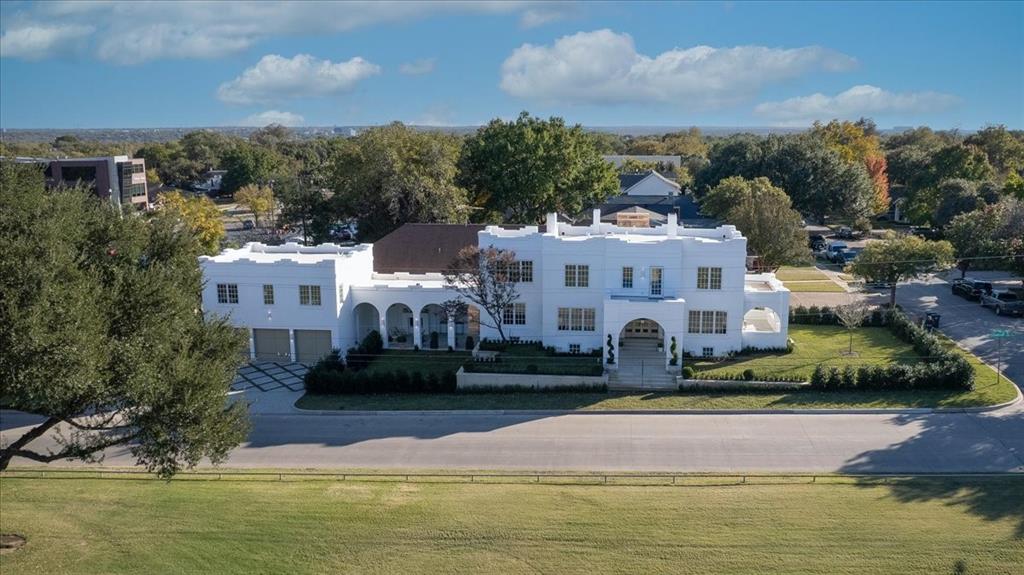 4259 Crestline Road Fort Worth, TX 76107 - Photo 37 of 40 a front view of a house with a garden and lake view