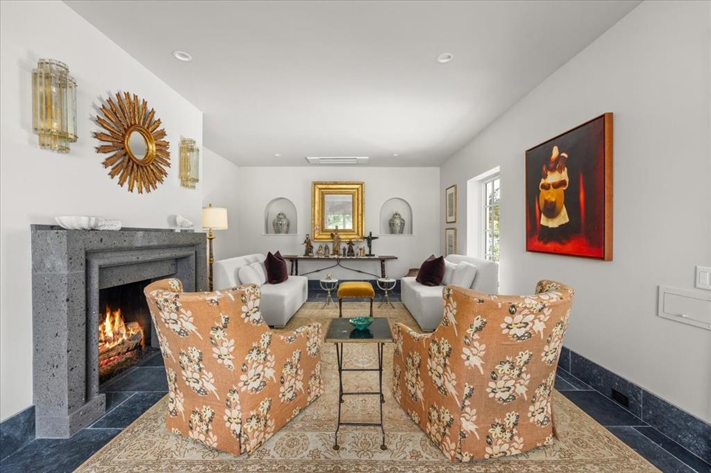 4259 Crestline Road Fort Worth, TX 76107 - Photo 10 of 40 a living room with furniture and a fireplace