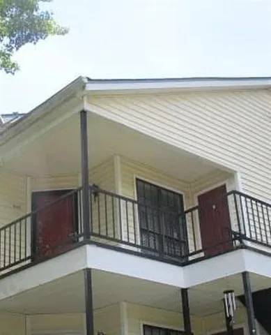 a view of a livingroom with a ceiling fan and window