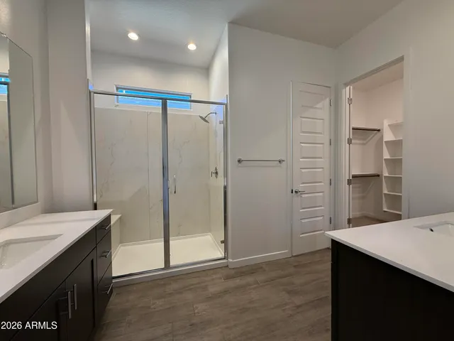 a view of a bathroom with a sink and a mirror