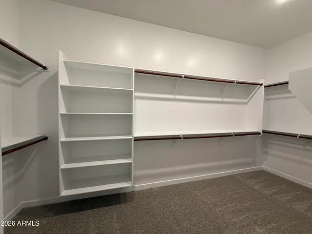 a view of an empty walk in closet